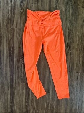 FP Movement by Free People Twist-Waist Leggings in Bright Orange